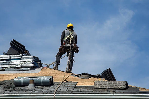 Professional Roof Replacement technician working in Tully, NY